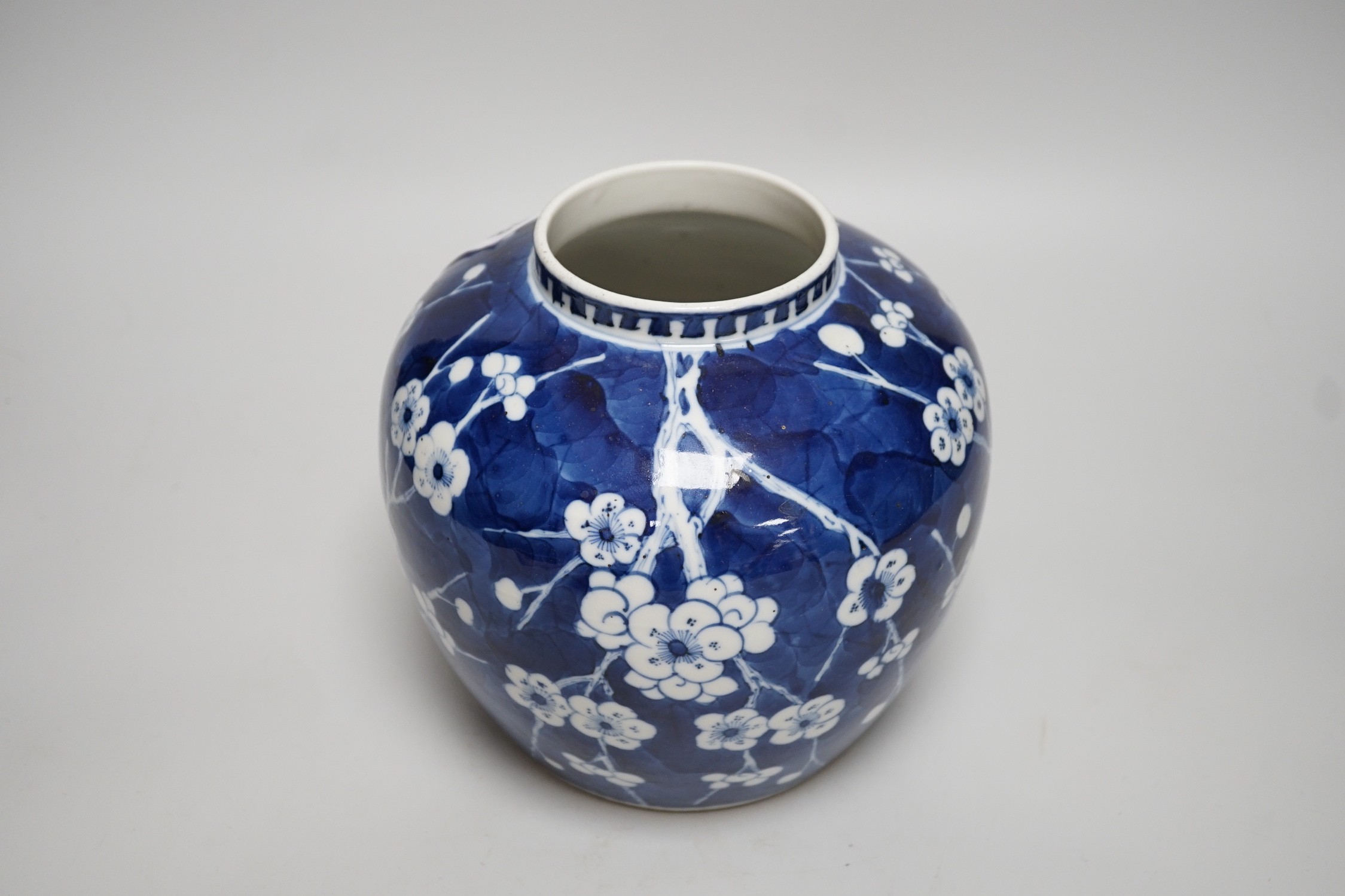 A Chinese blue and white prunus jar and cover, late 19th century, 20.5cms high